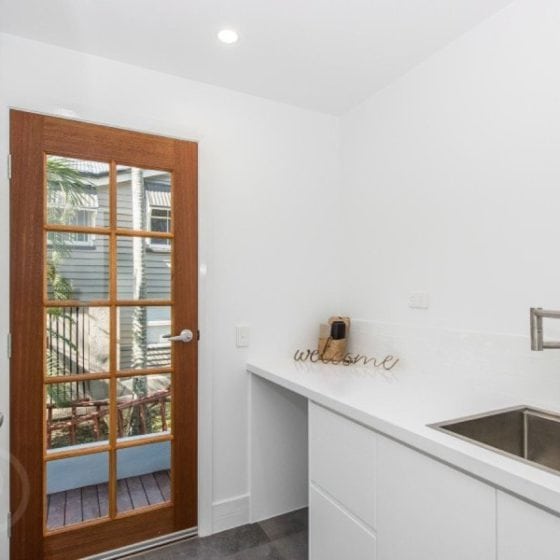 amazing builds new laundry with white walls and timber door frame