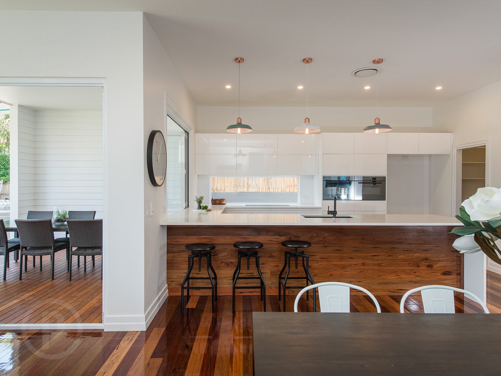 amazing builds kitchen with timber flooring and white walls