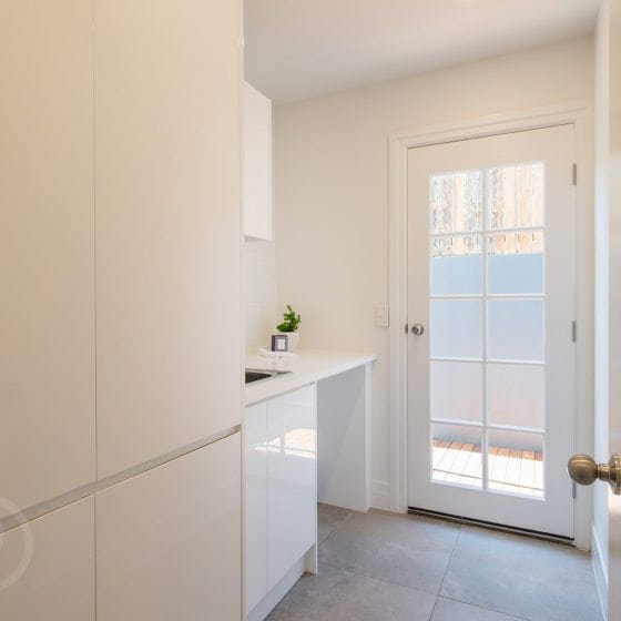 amazing builds laundry room with white walls