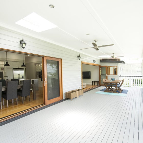 amazing builds long white covered deck with dining set